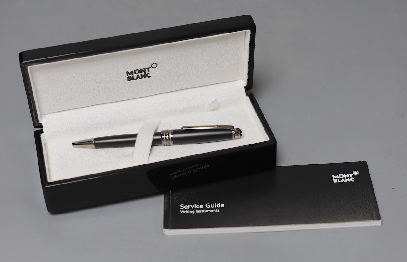 A Mont Blanc retractable ball point pen with original case, cardboard sleeve and service instructions